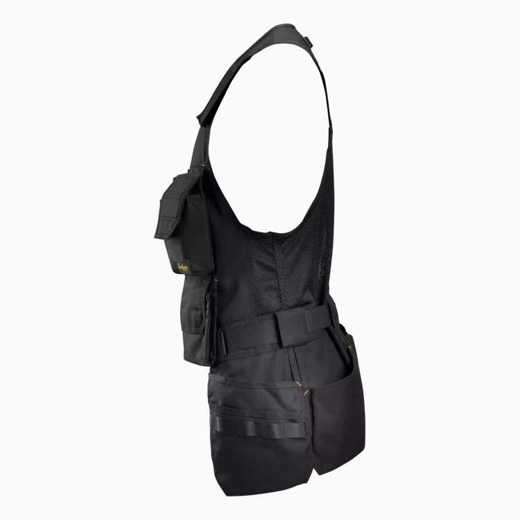 Black tactical vest with multiple front pockets, pouches, and a mesh back panel, shown from the side.