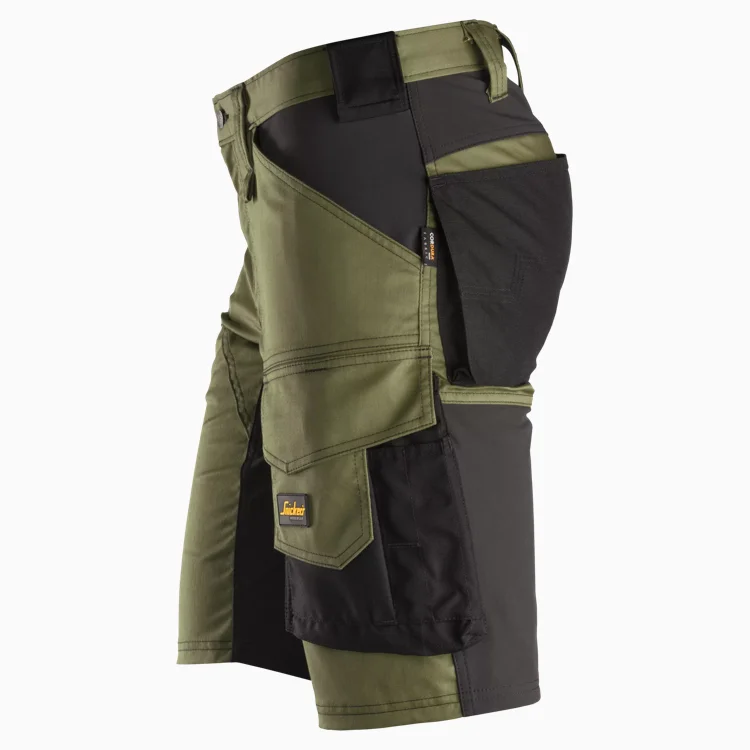 Side view of olive and black color-block cargo shorts with large pockets and a Dickies label.