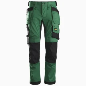 Green and black cargo work pants with multiple pockets and reinforced knees, harness-ready design with a brand patch on the side pocket area.