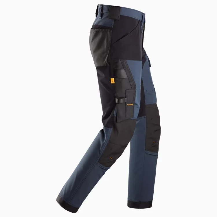 Color-block cargo work pants with multiple tool pockets and reinforced knees in blue, black, and gray.